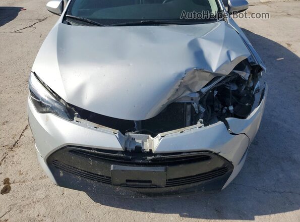 2T1BURHE7HC756556 2017 TOYOTA COROLLA Серебряный Вид задней части салона