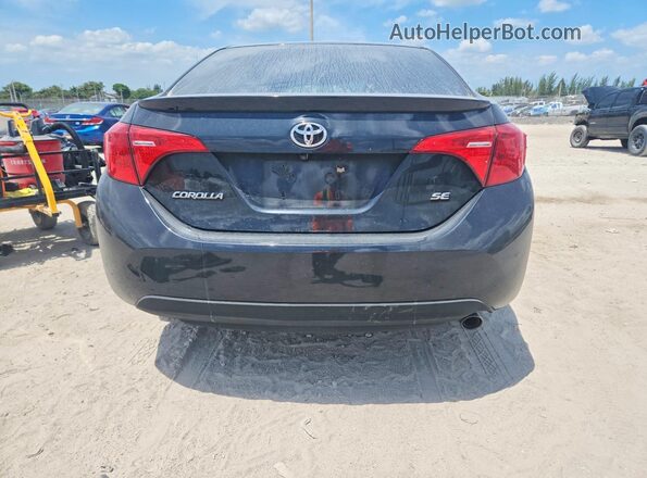 2T1BURHE7HC781523 2017 TOYOTA COROLLA Black Rear view