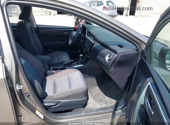 2T1BURHE7HC802273 2017 TOYOTA COROLLA Коричневый Вид салона спереди