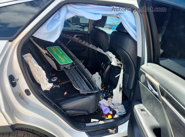2T2BZMCA9HC103862 2017 LEXUS RX White Rear seats view