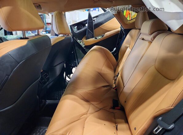 2T2GGCEZ6SC089452 2025 LEXUS NX Black Vista interior trasera