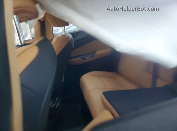 2T2GKCEZ9RC029741 2024 LEXUS NX Silver Vista de los asientos traseros