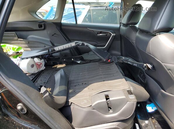 2T3B6RFV5PW039879 2023 TOYOTA RAV4 Black Vista interior trasera