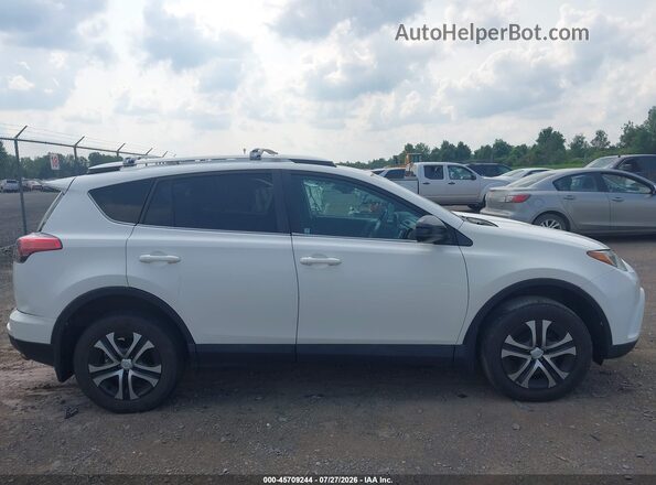 2T3BFREV0GW415924 2016 TOYOTA RAV4 Белый Вид задней части салона