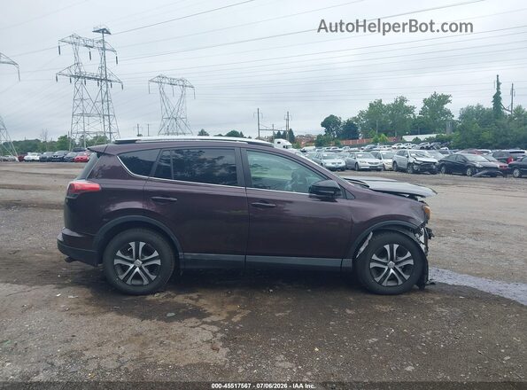 2T3BFREV2GW461562 2016 TOYOTA RAV4 Purple Vista interior trasera