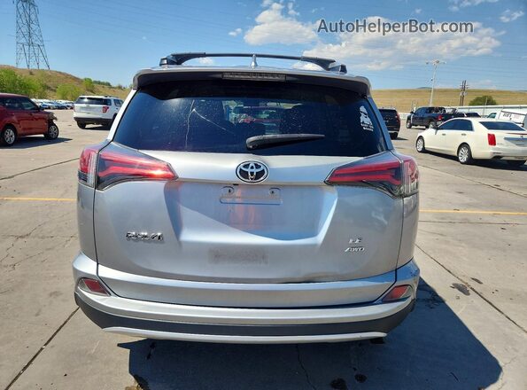 2T3BFREV4GW506274 2016 TOYOTA RAV4 Silver Вид ззаду