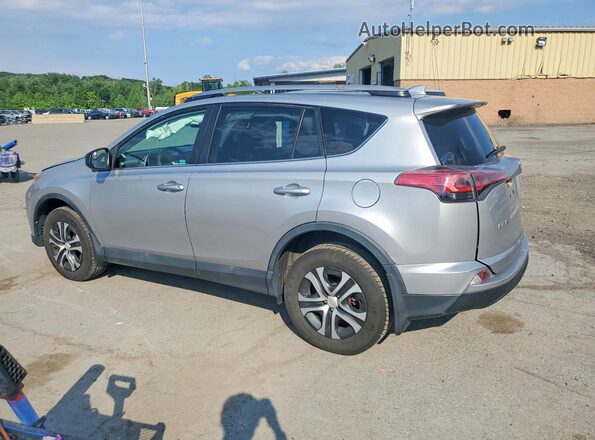 2T3BFREV4HW613035 2017 TOYOTA RAV4 Silver Trasero izquierdo