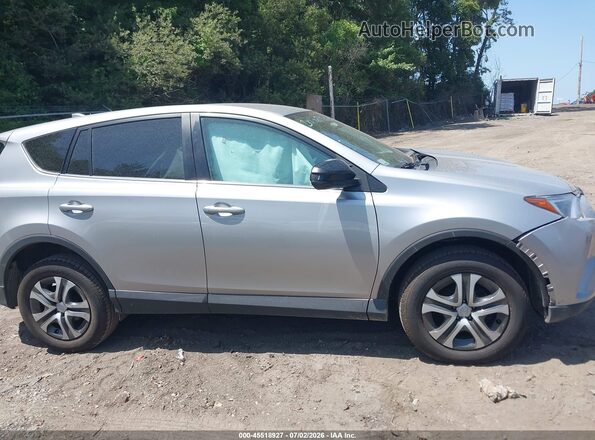 2T3BFREV4JW789136 2018 TOYOTA RAV4 Silver უკანა სალონის ხედი