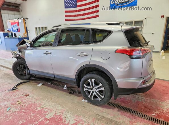 2T3BFREV7HW624255 2017 TOYOTA RAV4 Silver Trasero izquierdo