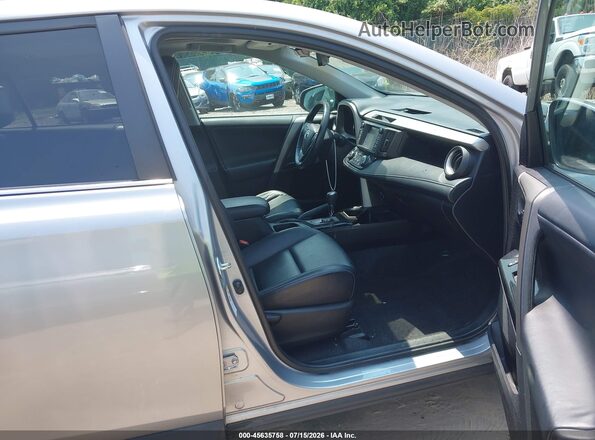 2T3DFREV3GW500328 2016 TOYOTA RAV4 Silver Front interior view
