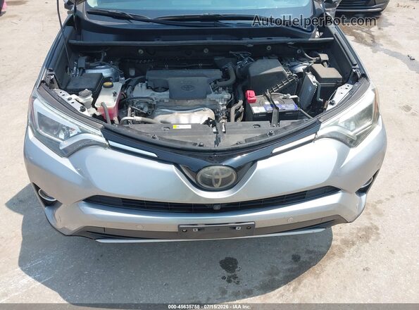 2T3DFREV3GW500328 2016 TOYOTA RAV4 Silver Rear view