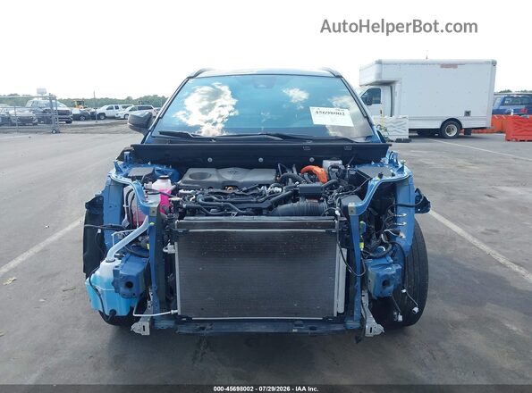 2T3E6RFV6PW043968 2023 TOYOTA RAV4 HYBRID Light Blue Widok wnętrza z tyłu