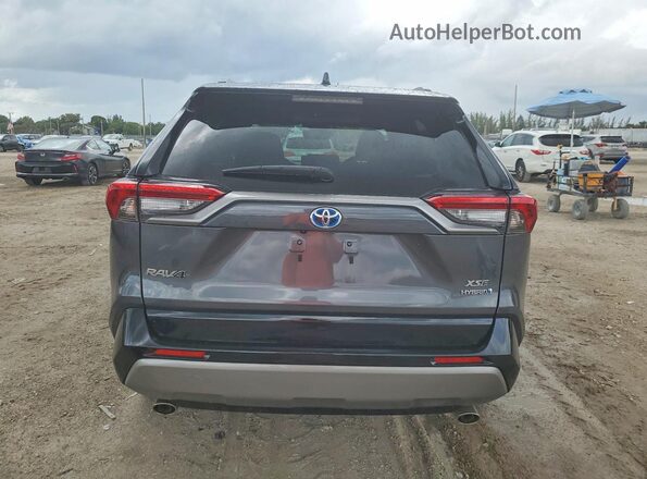 2T3E6RFV8PW045818 2023 TOYOTA RAV4 Charcoal Rear view