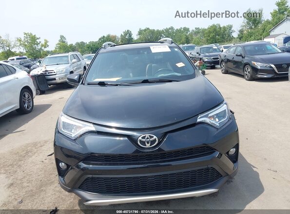 2T3JFREV1GW523464 2016 TOYOTA RAV4 Black Vista interior trasera