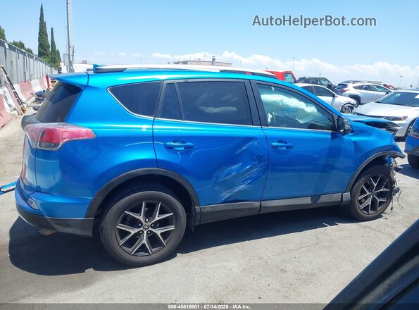 2T3NFREV1JW503319 2018 TOYOTA RAV4 Blue Rear interior view