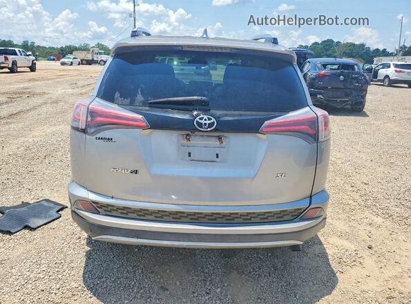 2T3NFREV3GW271637 2016 TOYOTA RAV4 Silver Vista trasera