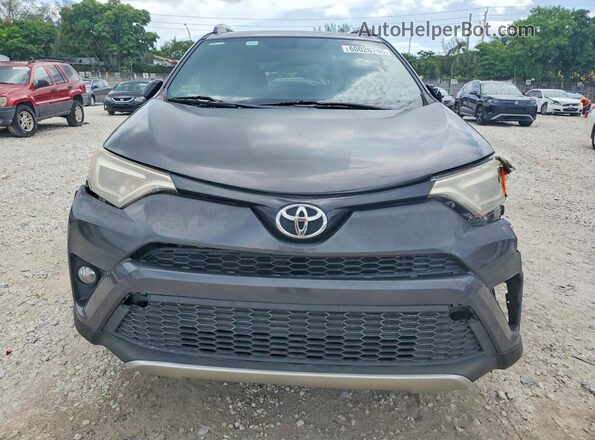 2T3NFREV7GW309712 2016 TOYOTA RAV4 Gray Vista frontal