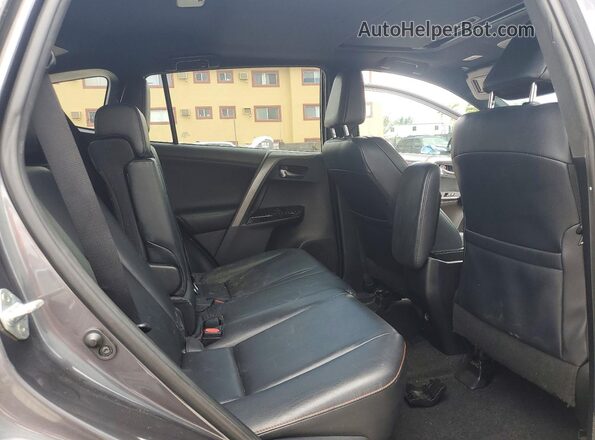 2T3NFREV7GW309712 2016 TOYOTA RAV4 Gray Vista de los asientos traseros