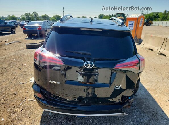 2T3RFREV0GW444922 2016 TOYOTA RAV4 Black Widok z tyłu