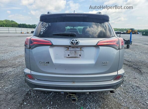 2T3RFREV1GW469523 2016 TOYOTA RAV4 Серебряный Вид сзади