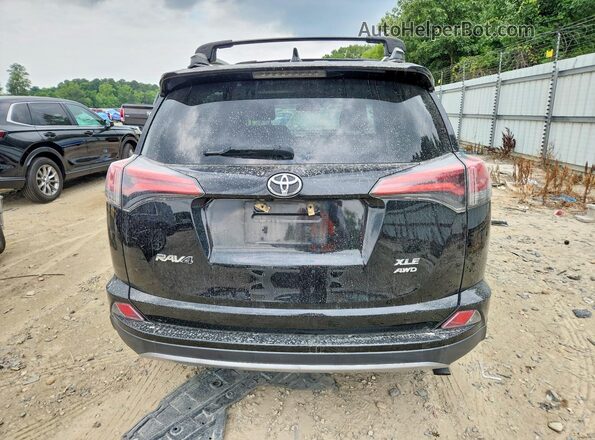 2T3RFREV1JW808675 2018 TOYOTA RAV4 Black Widok z tyłu
