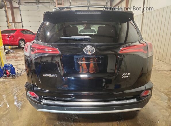 2T3RFREV1JW850697 2018 TOYOTA RAV4 Black Հետևի տեսք
