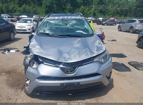 2T3RFREV3HW633873 2017 TOYOTA RAV4 Silver Սալոնի հետևի տեսք