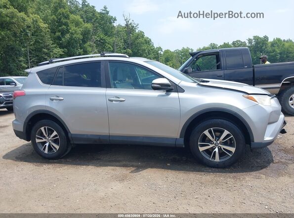 2T3RFREV3JW751704 2018 TOYOTA RAV4 Silver Սալոնի հետևի տեսք