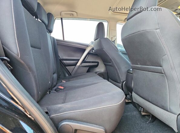2T3RFREV5JW798569 2018 TOYOTA RAV4 Black Vista interior trasera