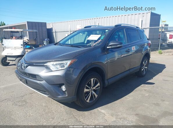 2T3RFREV8GW412350 2016 TOYOTA RAV4 Gray Vista tres cuartos delantera izquierda