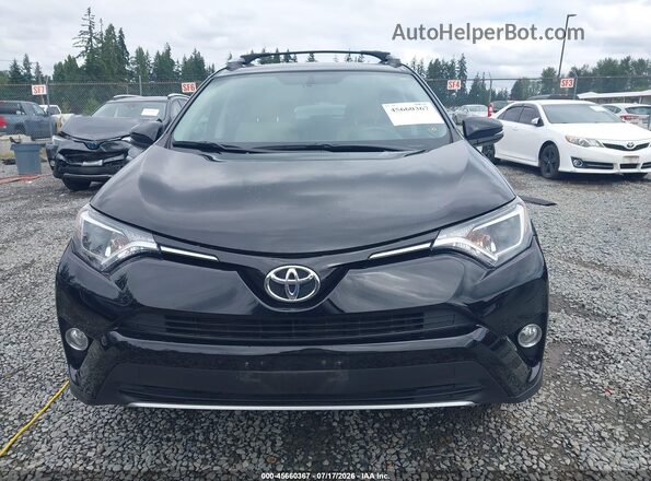 2T3RFREV8GW487646 2016 TOYOTA RAV4 Black Vista interior trasera