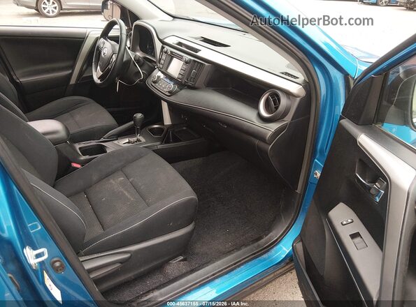 2T3RFREV8HW552884 2017 TOYOTA RAV4 Blue Front interior view