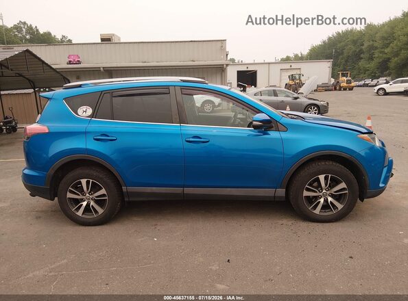 2T3RFREV8HW552884 2017 TOYOTA RAV4 Blue Rear interior view