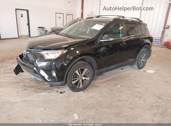2T3RFREV8JW732159 2018 TOYOTA RAV4 Black Front left