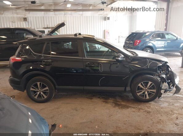 2T3RFREV8JW732159 2018 TOYOTA RAV4 Black Rear interior view