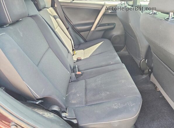 2T3RFREV8JW771608 2018 TOYOTA RAV4 Purple Rear seats view