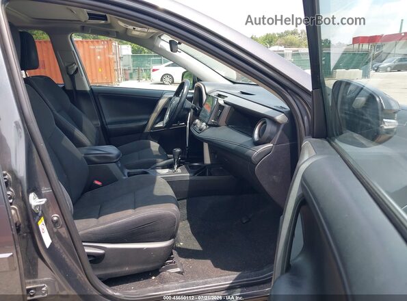 2T3RFREV8JW831032 2018 TOYOTA RAV4 Gray Vista interior delantera