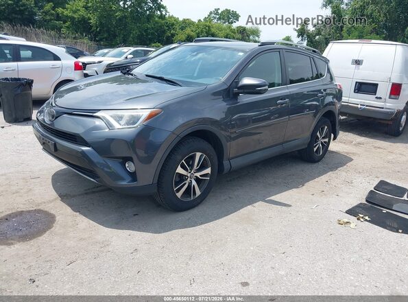 2T3RFREV8JW831032 2018 TOYOTA RAV4 Gray Vista tres cuartos delantera izquierda