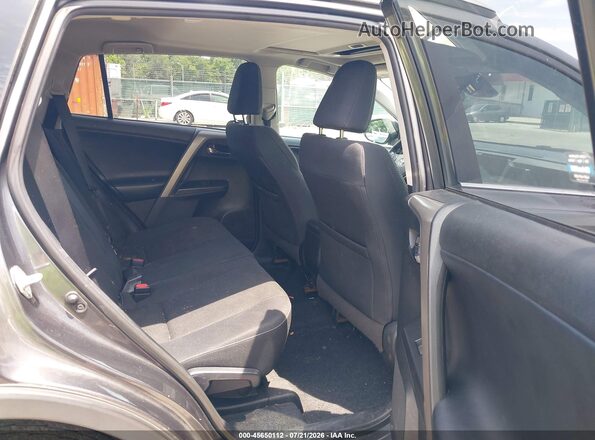 2T3RFREV8JW831032 2018 TOYOTA RAV4 Gray Vista de la etiqueta del VIN