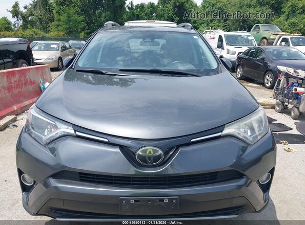 2T3RFREV8JW831032 2018 TOYOTA RAV4 Gray Vista interior trasera