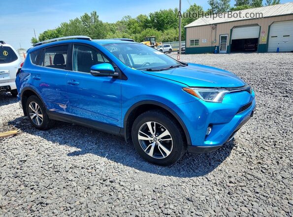 2T3RFREV9GW472587 2016 TOYOTA RAV4 Blue Front right