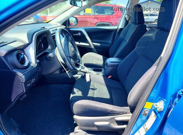 2T3RFREV9GW472587 2016 TOYOTA RAV4 Blue Front interior view