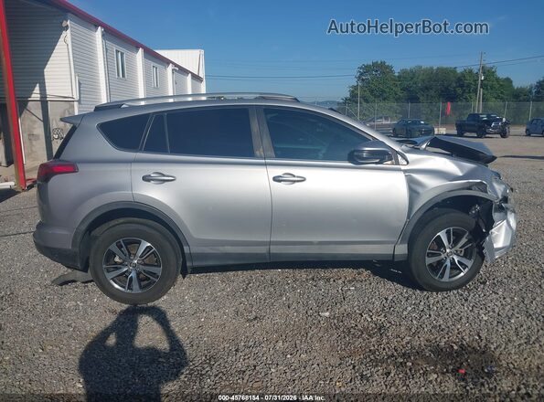 2T3RFREV9GW482732 2016 TOYOTA RAV4 Silver Vista interior trasera
