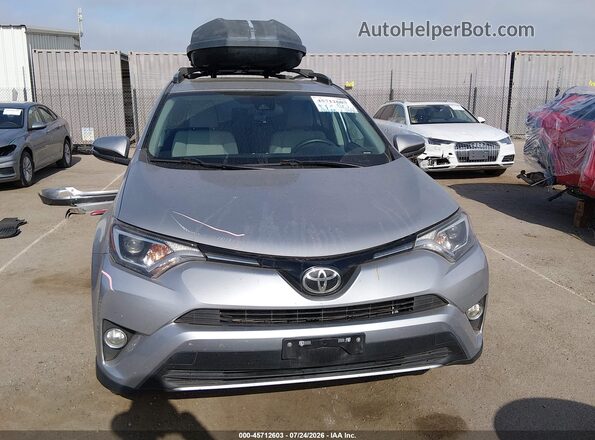 2T3RFREV9HW643260 2017 TOYOTA RAV4 Silver Սալոնի հետևի տեսք
