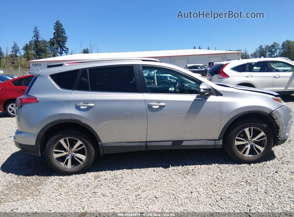 2T3RFREVXHW574255 2017 TOYOTA RAV4 Silver Vista interior trasera