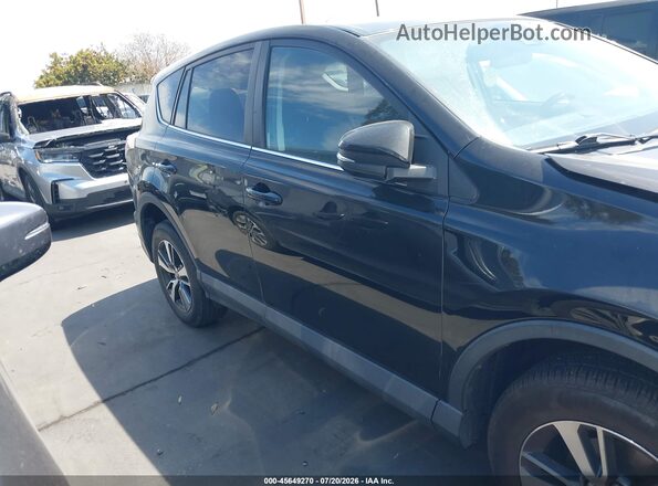 2T3RFREVXJW809842 2018 TOYOTA RAV4 Черный Вид задней части салона