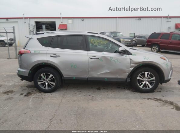 2T3WFREV0JW423580 2018 TOYOTA RAV4 Silver Rear interior view