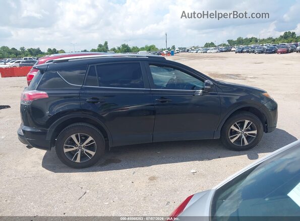 2T3WFREV1HW369054 2017 TOYOTA RAV4 Black Widok wnętrza z tyłu
