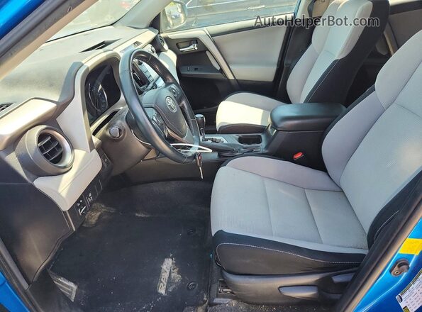 2T3WFREV2GW289101 2016 TOYOTA RAV4 Blue Vista interior delantera
