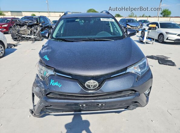 2T3WFREV3JW405753 2018 TOYOTA RAV4 Gray Вид спереду
